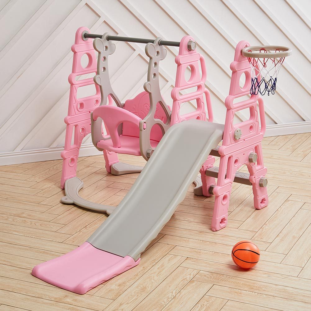 Garden Sanctuary toddler swing and slide set with pink and blue colors, includes a small basketball hoop for kids' outdoor play.