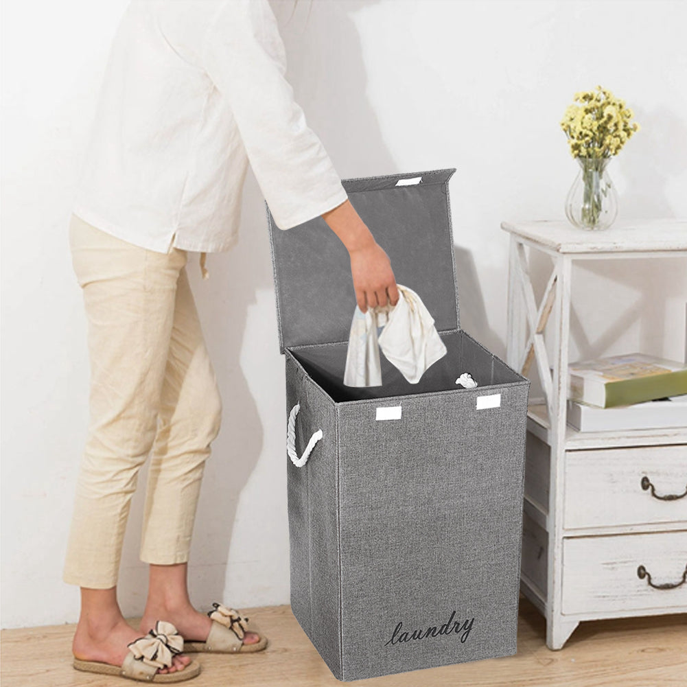 Foldable Garden Sanctuary laundry hamper with handles, made of durable fabric, ideal for home laundry organization and storage.
