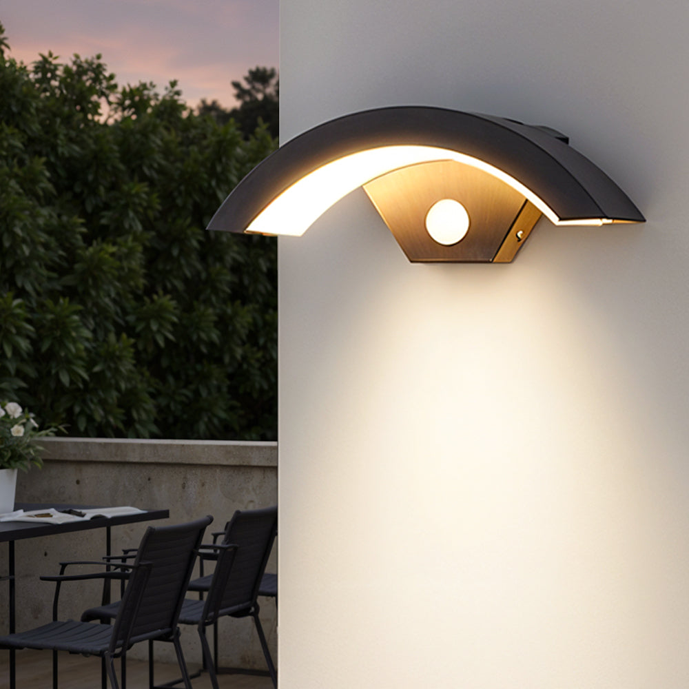 Modern black LED curved induction wall light for outdoor use by Garden Sanctuary, installed on exterior wall.