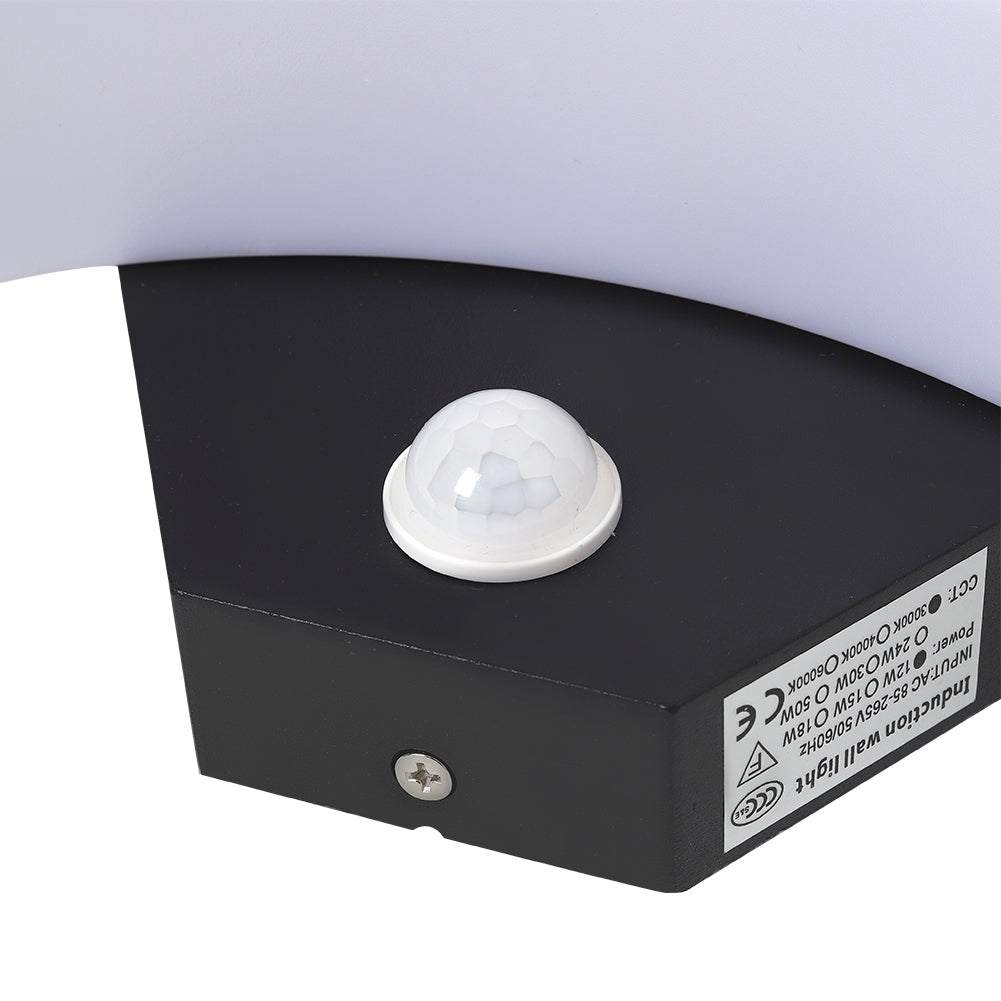 Modern black LED curved outdoor wall light by Garden Sanctuary, sleek induction design for outdoor illumination.