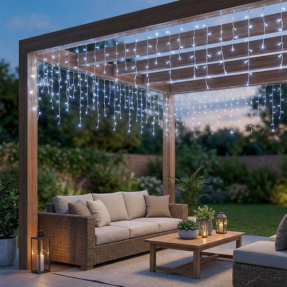 Solar-powered LED icicle string lights from Garden Sanctuary with remote control, hanging icicle design for outdoor holiday decor.