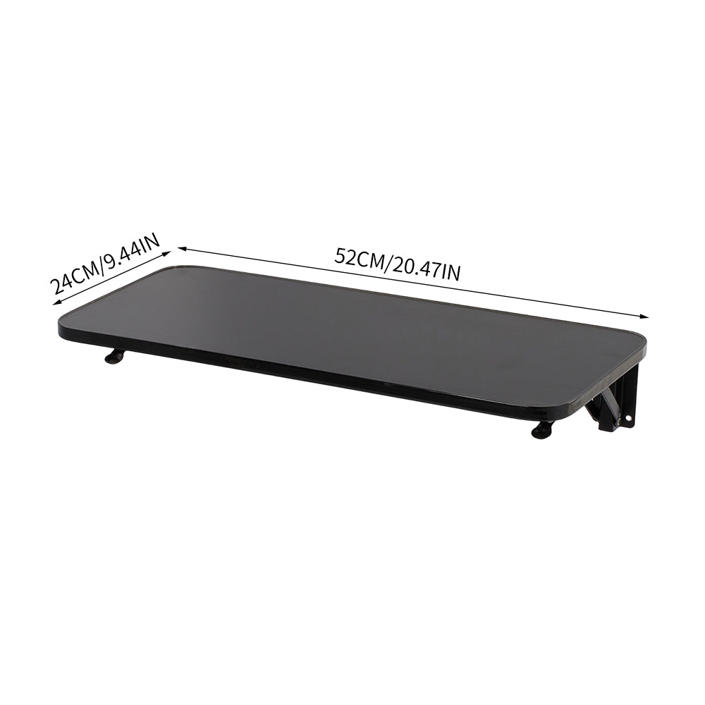 Wall-mounted folding table with iron brackets from Garden Sanctuary, showing the sturdy wooden surface and metal support brackets.