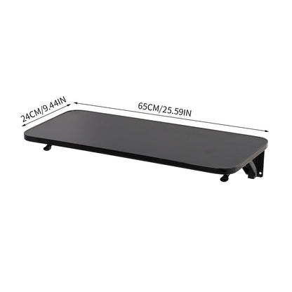 Wall-mounted folding table with iron brackets from Garden Sanctuary, showing the sturdy wooden surface and metal support brackets.