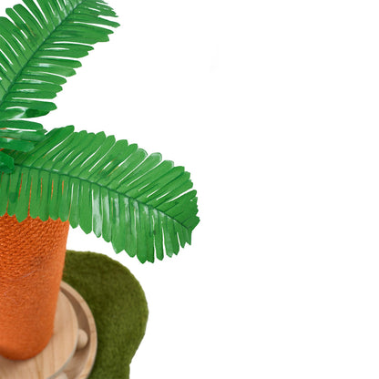 Garden Sanctuary carrot-shaped cat litter box with built-in scratching post and turntable toy for feline entertainment.