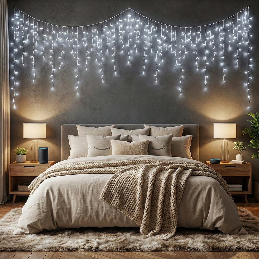 Solar-powered LED icicle string lights with remote control by Garden Sanctuary, hanging with glowing icicles for outdoor decor.