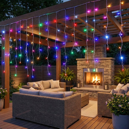 Garden Sanctuary solar-powered LED icicle string lights with remote control hanging outdoors at night